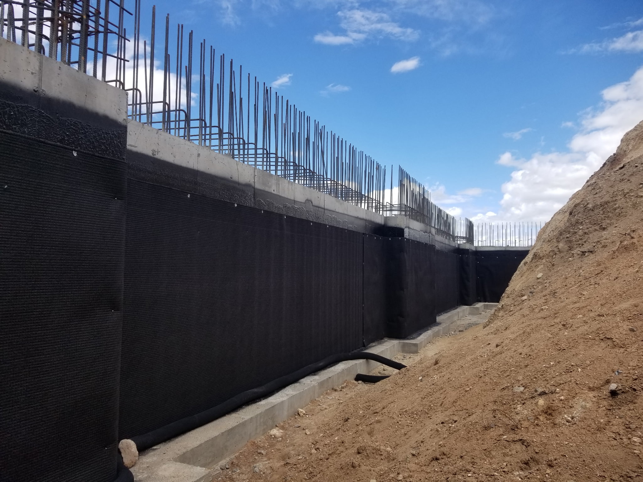 Footing drain and drain board installation