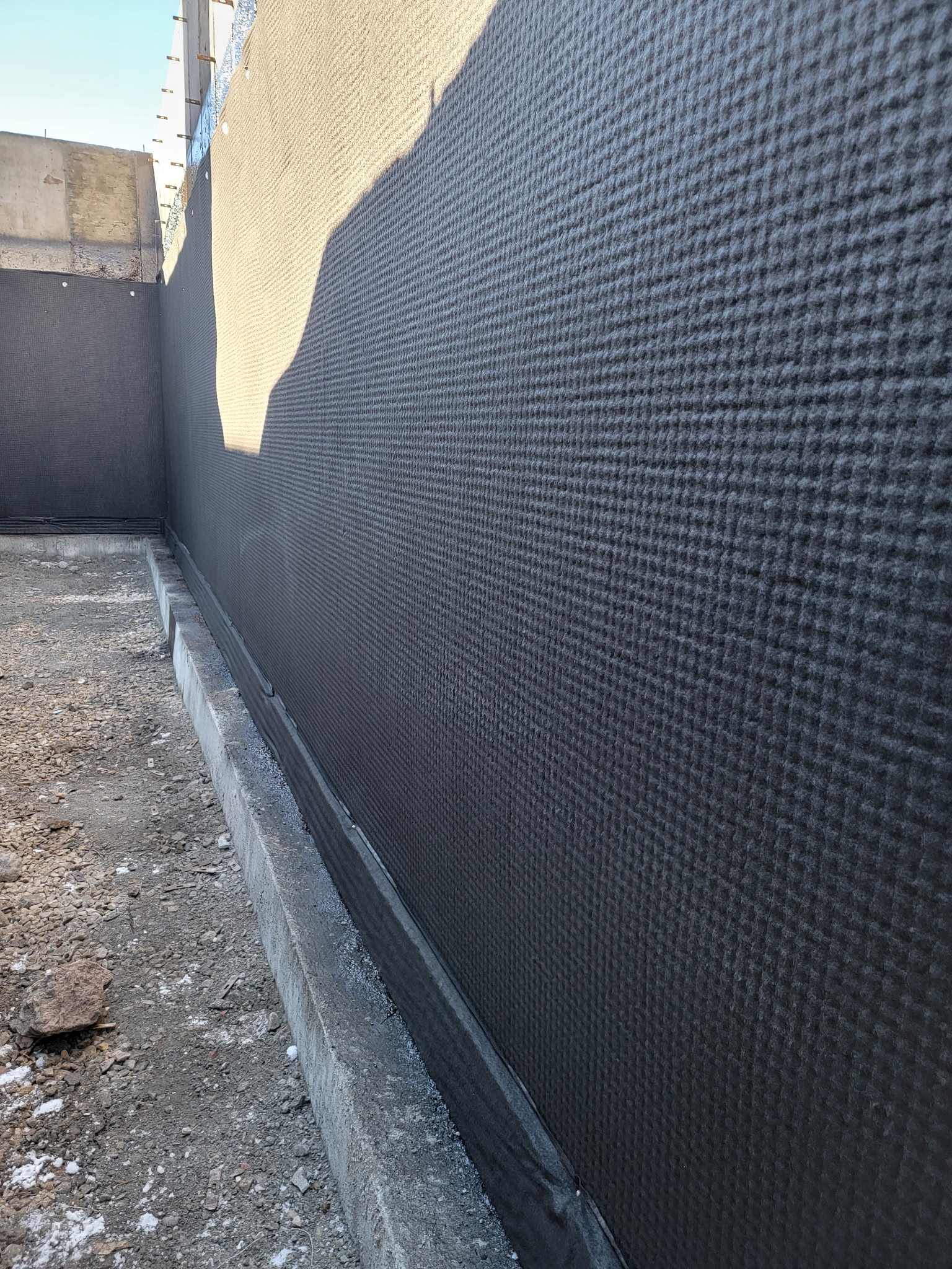 Footing drain and drain board installation